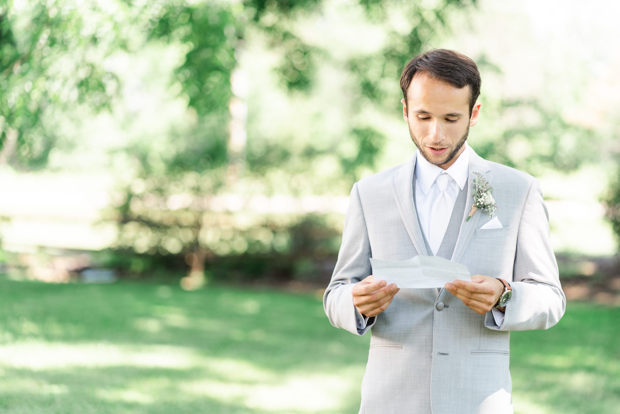 Groom reads letter from bride june wedding